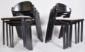 A set of seven 1970's black lacquered stacking chairs, with drop in seats,