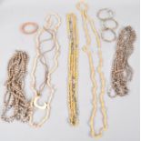 A collection of jewellery to include four bracelets and a collection of beaded/shell necklaces.
