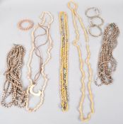 A collection of jewellery to include four bracelets and a collection of beaded/shell necklaces.