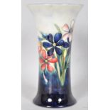 A Moorcroft pottery "Spring Flower" pattern tube lined vase of waisted form,