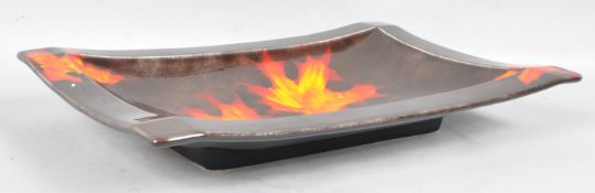 A large modern Poole Pottery rectangular dish, decorated with leaves,