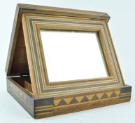 A 20th century marquetry dressing box, fitted with inset mirror,