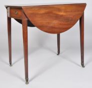 An Edwardian mahogany drop leaf table with single drawer and faux drawer ends,