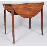 An Edwardian mahogany drop leaf table with single drawer and faux drawer ends,