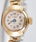 A yellow gold Excalibur wristwatch. 21 Jewel manual wind movement.