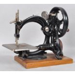 A Willcox Gibbs sewing machine, circa 1900, on replacement plinth,