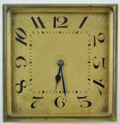 An Art Deco brass square frame strut clock with gold Arabic dial,