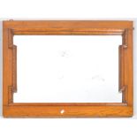 An oak rectangular mirror frame, circa 1890-1910,