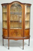 An Edwardian mahogany display cabinet, in the George III style, D shaped,