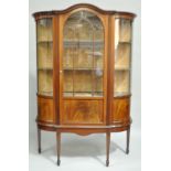 An Edwardian mahogany display cabinet, in the George III style, D shaped,