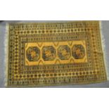 A yellow rug with central panel woven with octagonal medallions within geometric panels of foliate,