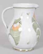 An Aldermaston pottery jug, of globular form with stylised floral decoration, 19cm high,