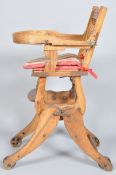 A 19th century metamorphic child's high/rocking chair, on cast iron wheels,