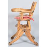 A 19th century metamorphic child's high/rocking chair, on cast iron wheels,
