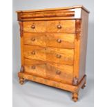 A Victorian mahogany large chest of drawers with carved acanthus supports and rounded frieze,