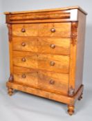 A Victorian mahogany large chest of drawers with carved acanthus supports and rounded frieze,