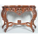 A reproduction mahogany console table with pierced carved details on cabriole legs, 80cm high,