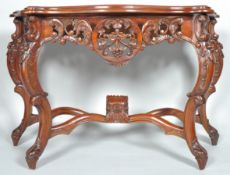 A reproduction mahogany console table with pierced carved details on cabriole legs, 80cm high,