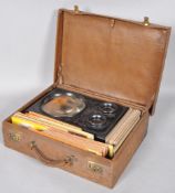 A Victorian stereoscope graphoscope viewer with 100 early stereoview photos,