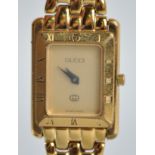 A gold plated Gucci wristwatch, model reference 4200L. Quartz movement, gold plated bracelet.