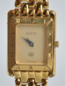 A gold plated Gucci wristwatch, model reference 4200L. Quartz movement, gold plated bracelet.