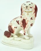 A Victorian Staffordshire porcelain figure of a spaniel,