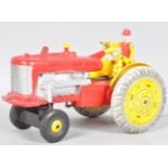 A combination tin plate battery operated reversible tractor toy,