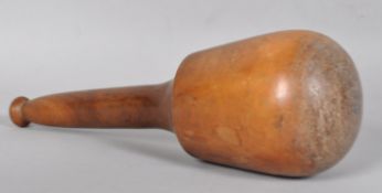 A 19th century fruitwood loom weight with turned tapering handle and knoop finial,