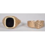 A yellow metal onyx signet ring, hallmark 9ct gold, size Y together with buckle ring.