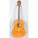 A Spanish Giannini GN-70 acoustic guitar with geometric marquetry inlay,