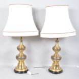 A pair of gilt metal Asian style lamp bases each of graduated bell gourd form,