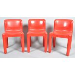 A group of three 4875 red moulded polypropylene chairs, designed by Carlo Bartoli (61931),
