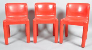 A group of three 4875 red moulded polypropylene chairs, designed by Carlo Bartoli (61931),