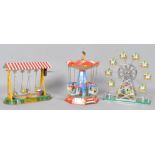 Two modern German Nornberger Blechspielzeug tinplate fairground model toys, the carousel, 22cm high,