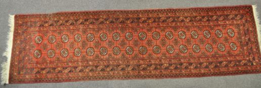 A Bedouin style runner in the usual rust,