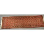 A Bedouin style runner in the usual rust,