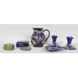 Seven items of Moorcroft "Anemone" pattern pottery, comprising; a blue ground baluster jug,