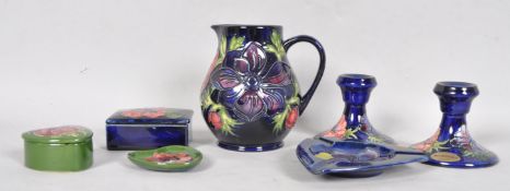 Seven items of Moorcroft "Anemone" pattern pottery, comprising; a blue ground baluster jug,