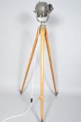 A retro vintage spot light/theatre lamp on beech tripod stand