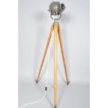 A retro vintage spot light/theatre lamp on beech tripod stand