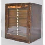 An Edwardian mahogany collectors cabinet, the glazed door enclosing twenty numbered drawers,