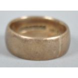 A yellow metal 7.5mm D shape wedding ring. Hallmarked 9ct gold, Birmingham, 1959.
