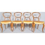 A set of four Victorian mahogany balloon back dining chairs,