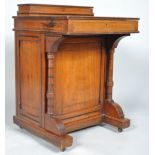 A Victorian oak Davenport,