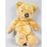 A Merry Thought plush mohair jointed body teddy bear, with growler, label to a foot,