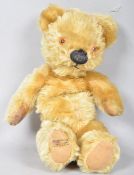 A Merry Thought plush mohair jointed body teddy bear, with growler, label to a foot,