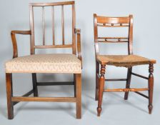 An elm country armchair, 19th century with reeded uprights and scroll arms,