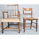 An elm country armchair, 19th century with reeded uprights and scroll arms,