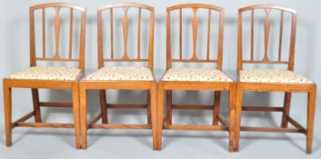 A set of six early 19th century elm dining chairs with slender vase shaped splat and reeded