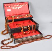 A large jewellery case having six individual large beaded necklaces having gross weight of 321.